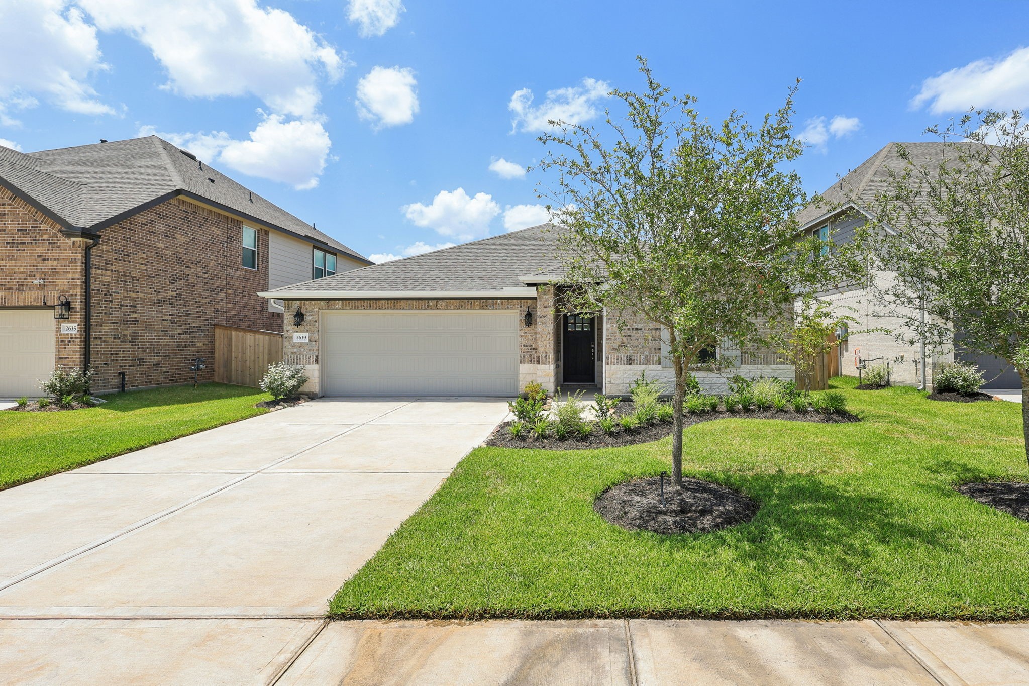 a front view of a house with garden