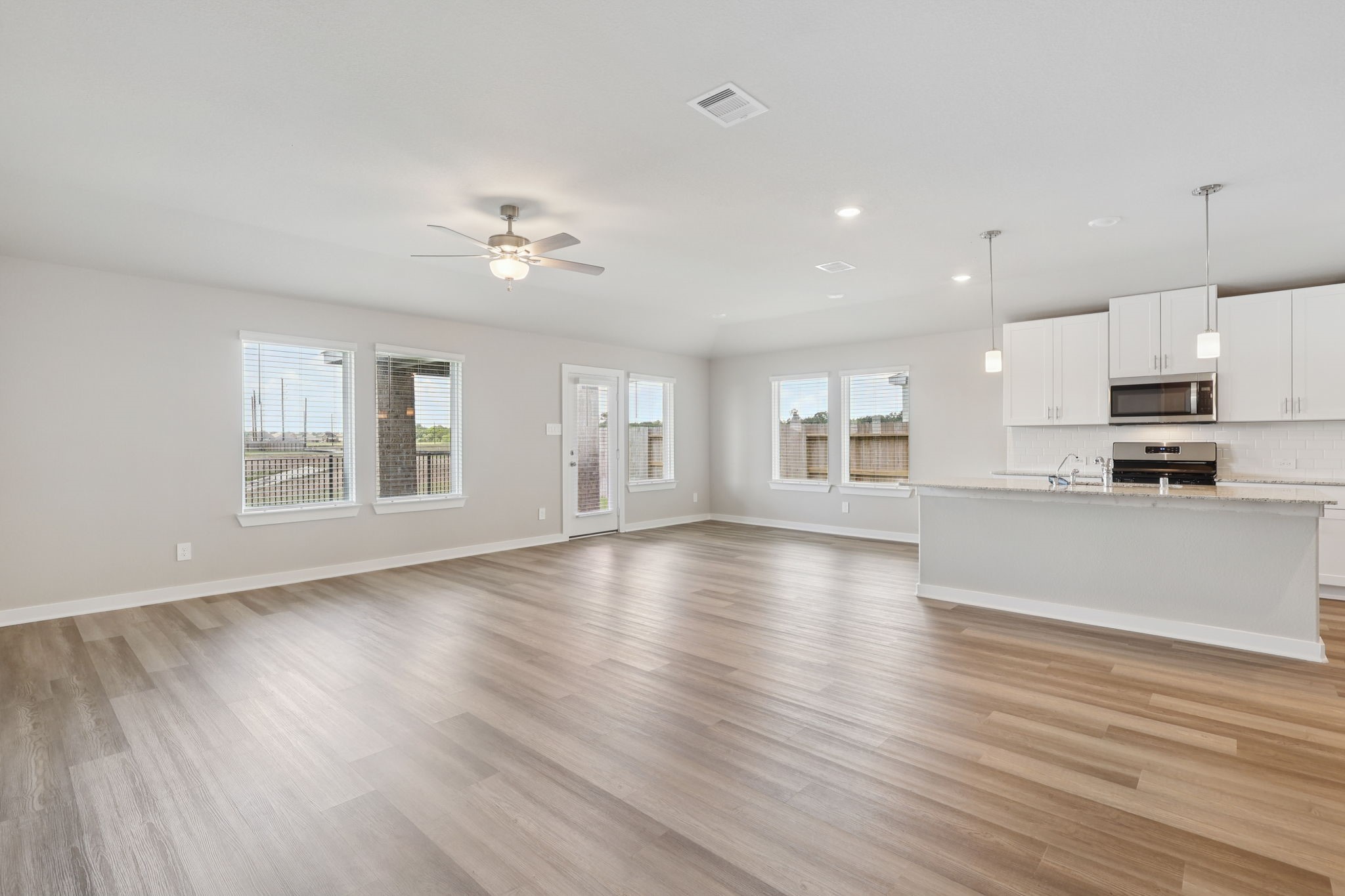 2639 Clapbread Lane Rosenberg, TX 77471 - Photo 11 of 31 a view of kitchen with stove and wooden floor
