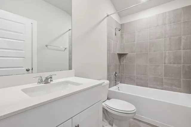 a bathroom with a sink a toilet and a bathtub