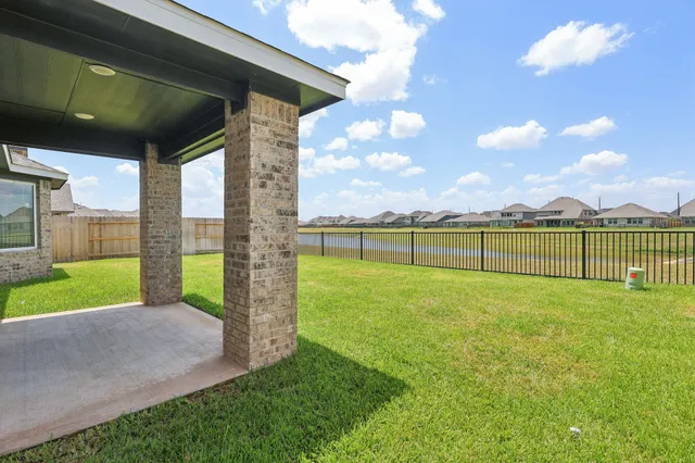 a view of a big yard next to a house