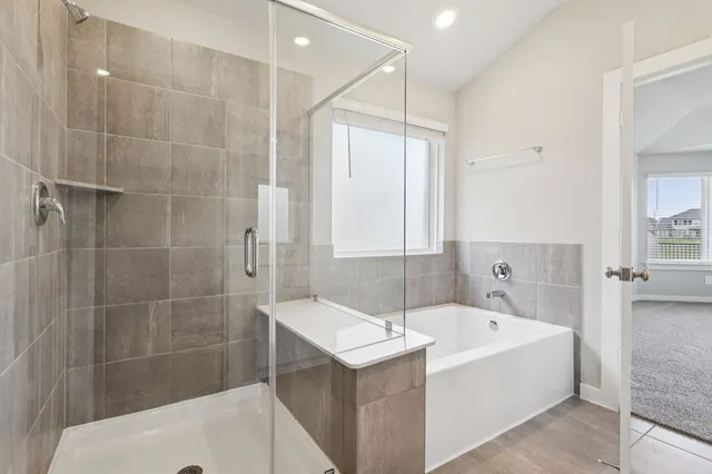a bathroom with a bathtub and a sink