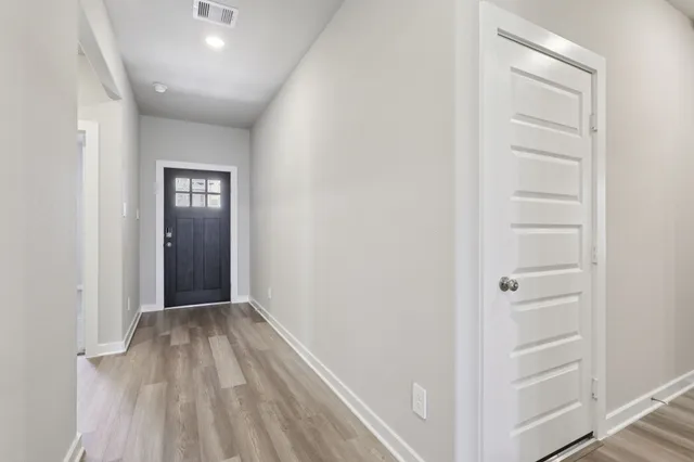 a view of hallway with closet