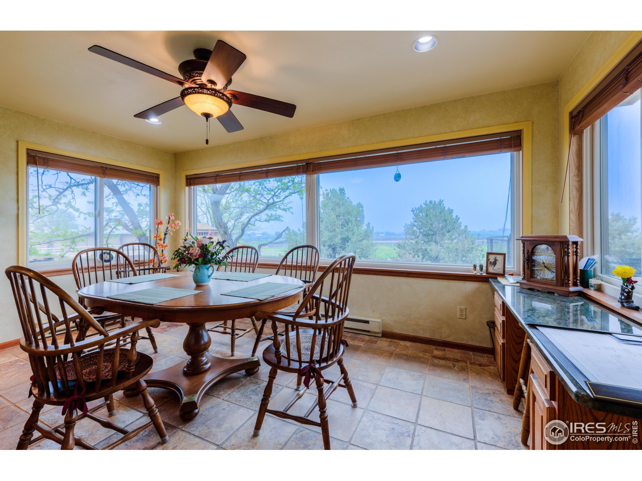 10024 Lookout Road Lafayette, CO 80026 - Photo 12 of 37 Breakfast nook has south, east and west windows looking out over the property.