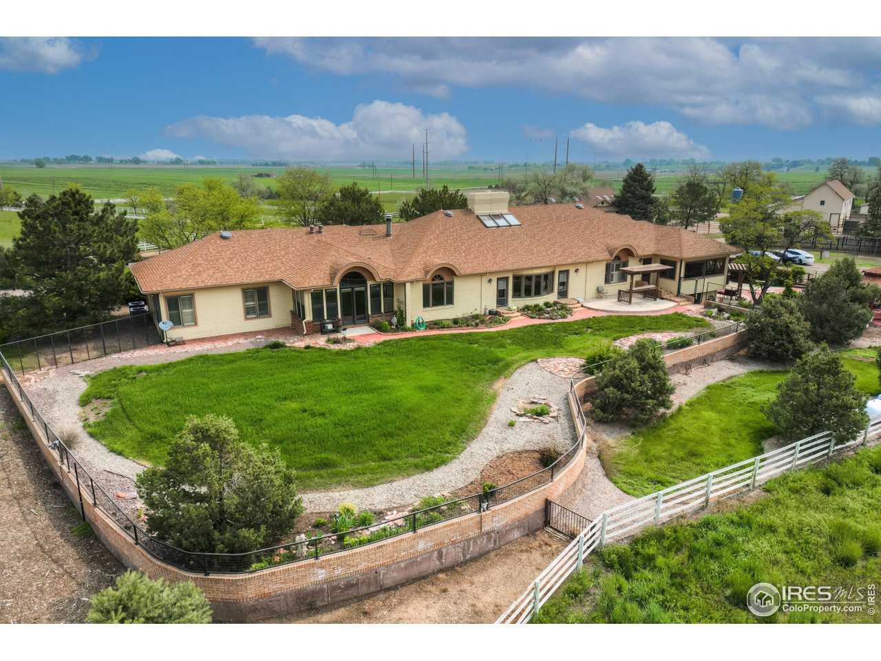 10024 Lookout Road Lafayette, CO 80026 - Photo 17 of 37 View of the back of the main residence looking north. Beautiful fenced yard.