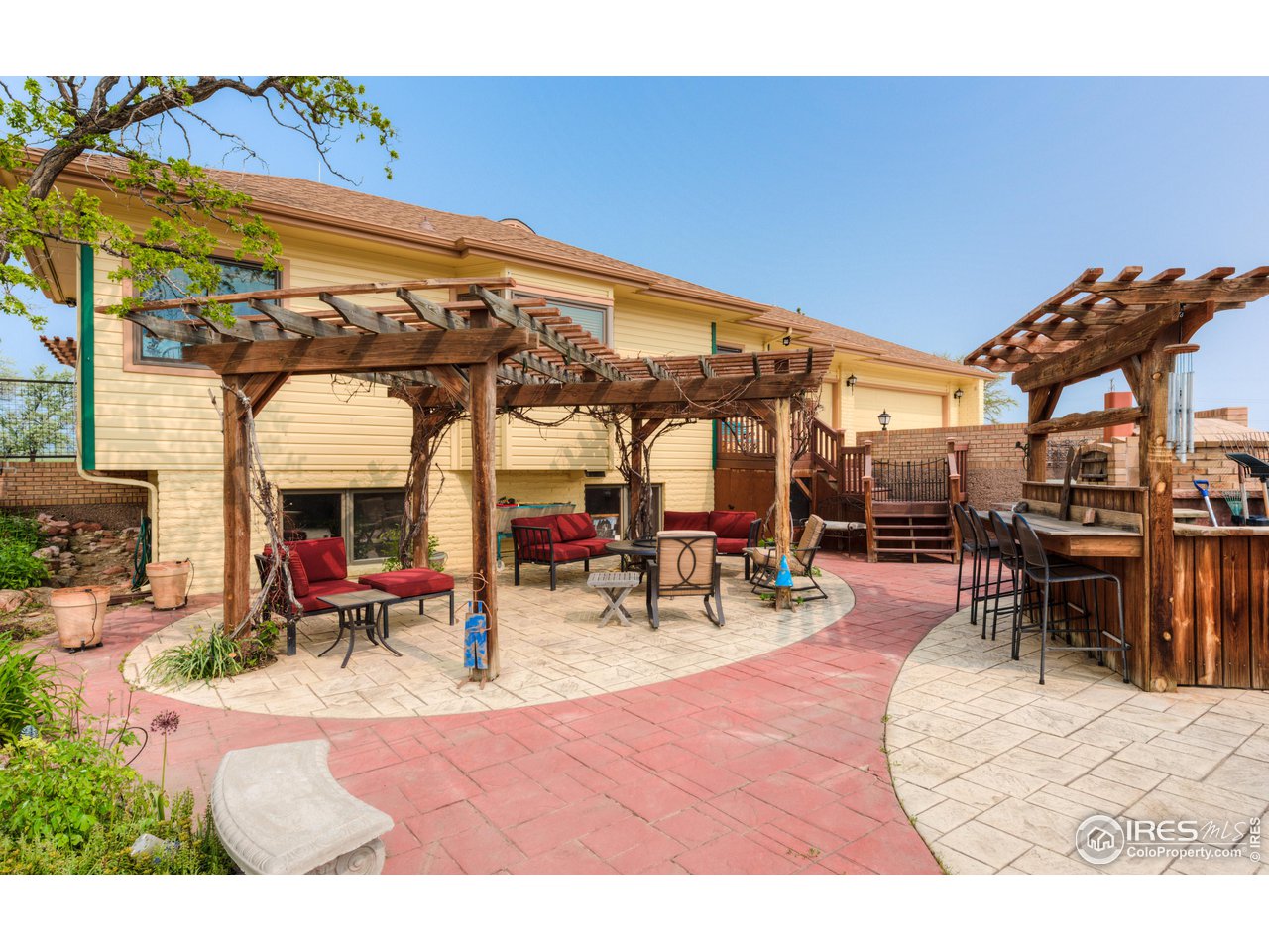 10024 Lookout Road Lafayette, CO 80026 - Photo 18 of 37 Patios on the east side of the main residence. Pizza oven and seating areas.
