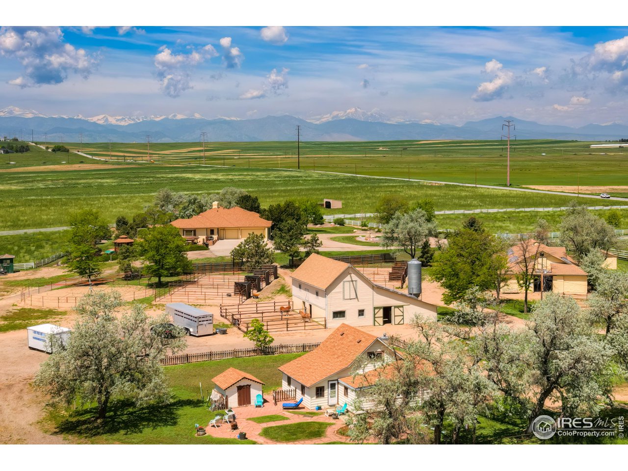 10024 Lookout Road Lafayette, CO 80026 - Photo 2 of 37 Looking west to the mountains. ADU in front of picture, South Barn just above it, North Barn to the right and main residence to the upper left above the South Barn.