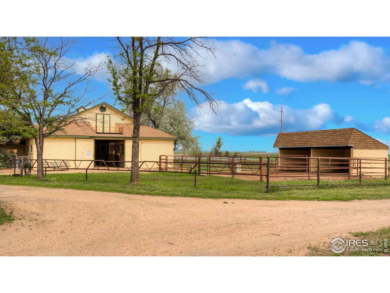 10024 Lookout Road Lafayette, CO 80026 - Photo 21 of 37 North Barn with cinder block loafing shed and pipe runs.
