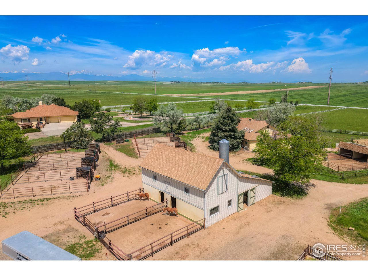 10024 Lookout Road Lafayette, CO 80026 - Photo 24 of 37 South barn with attached runs for two of the stalls.
