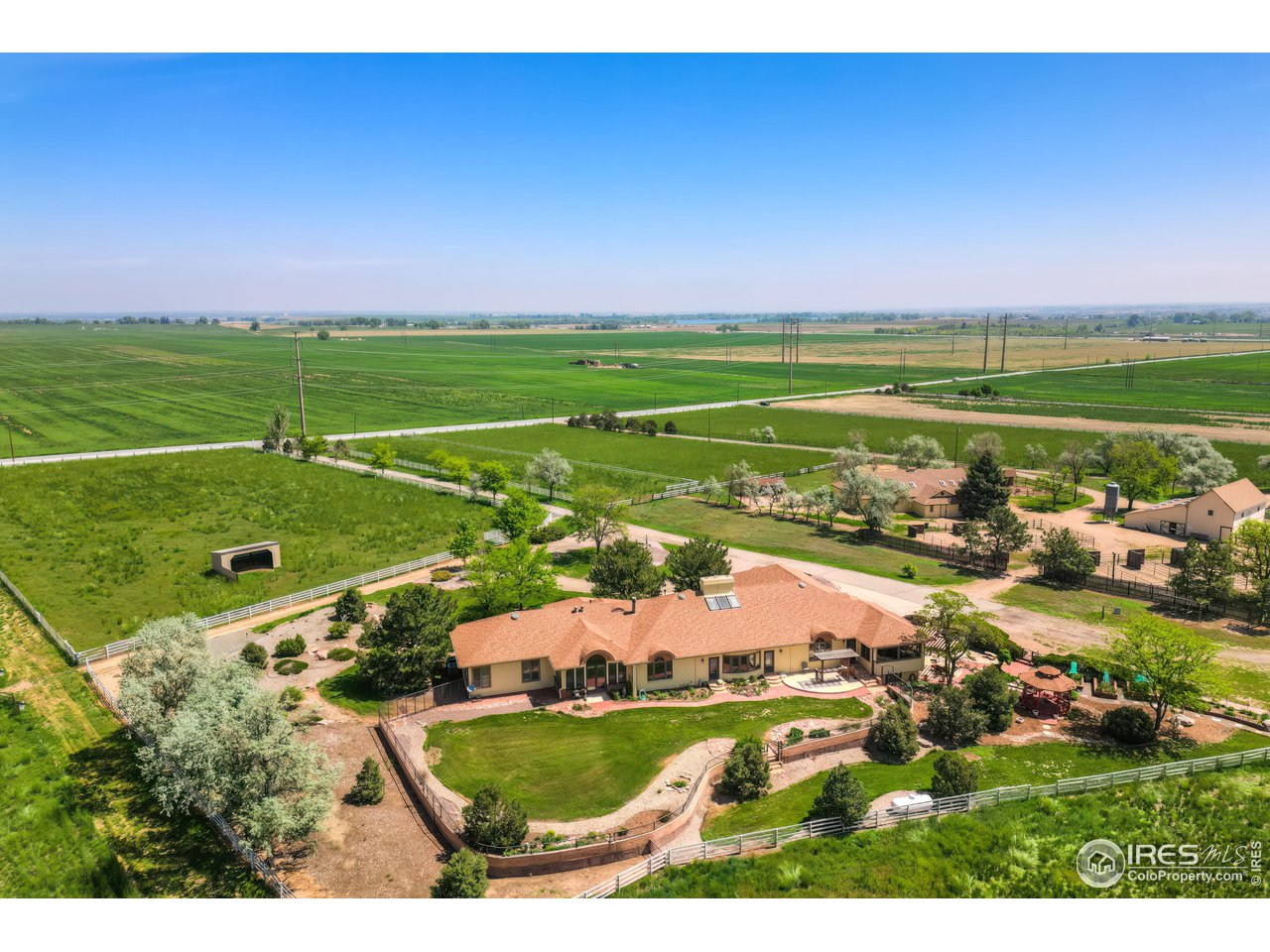 10024 Lookout Road Lafayette, CO 80026 - Photo 36 of 37 View of the back of the main Residence looking north-east with the Barns on the right.