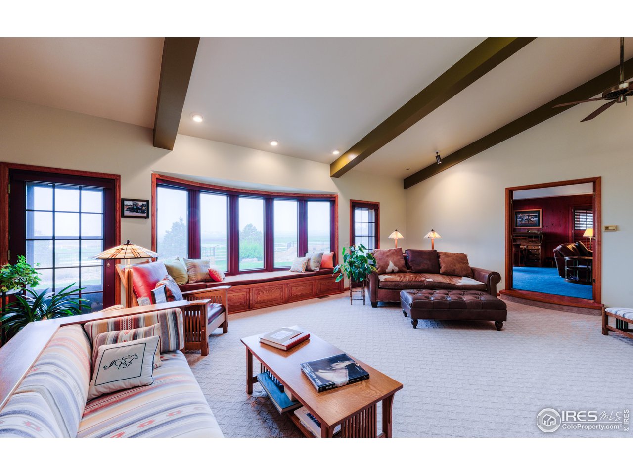 10024 Lookout Road Lafayette, CO 80026 - Photo 6 of 37 Living room has south facing windows and is open to the Library.