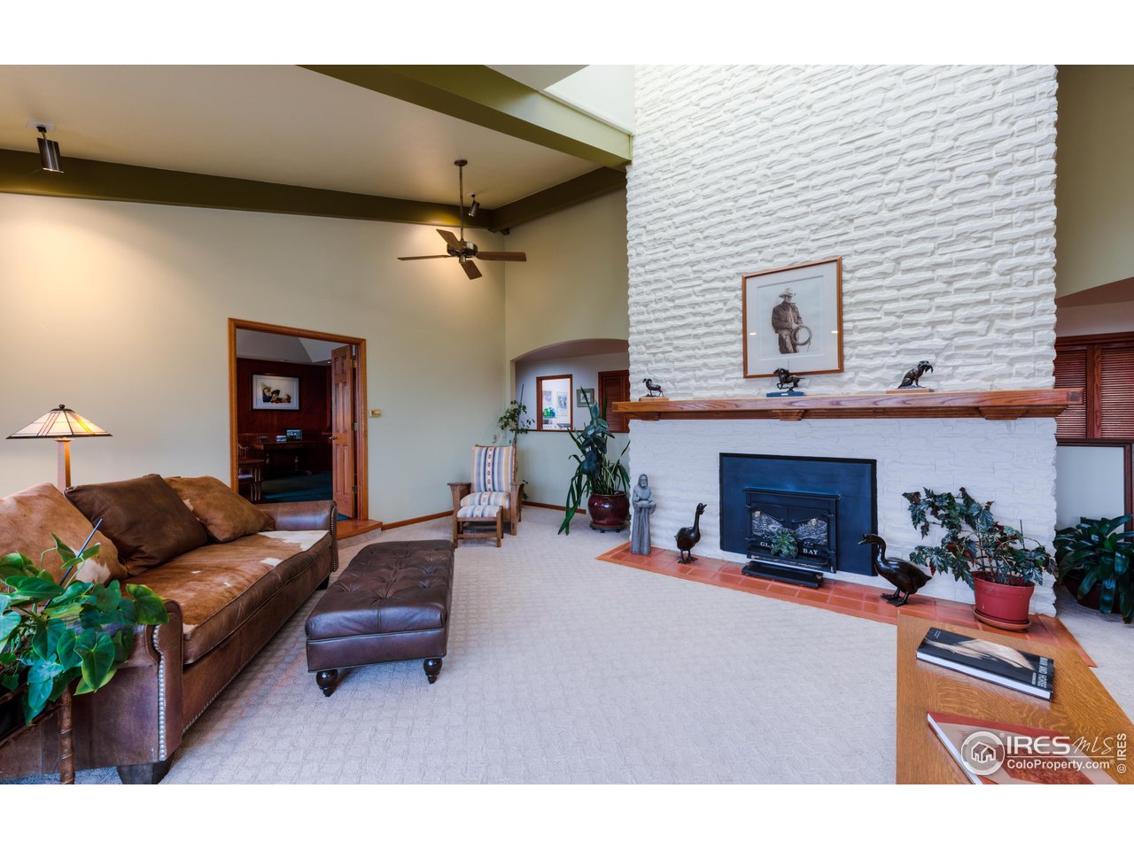10024 Lookout Road Lafayette, CO 80026 - Photo 7 of 37 Living room with brick hearth.