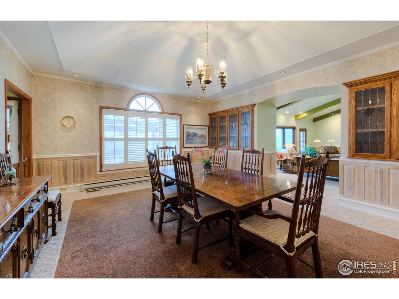 10024 Lookout Road Lafayette, CO 80026 - Photo 9 of 37 Formal Dining room open to Living Room has beautiful built-ins and south facing windows