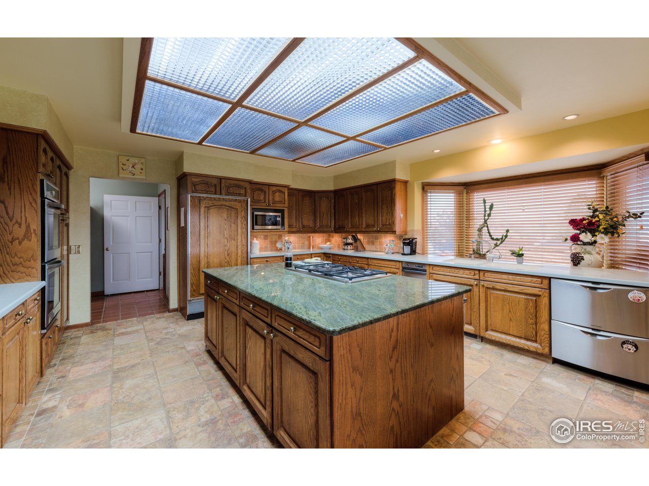 10024 Lookout Road Lafayette, CO 80026 - Photo 10 of 37 Spacious Kitchen with gas range and double dishwashers.