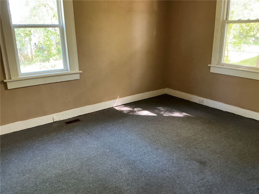 11 Humbert Street Seneca, SC 29678 - Photo 11 of 14 Sunlight fills this bedroom, highlighting the clean carpet and neutral walls.