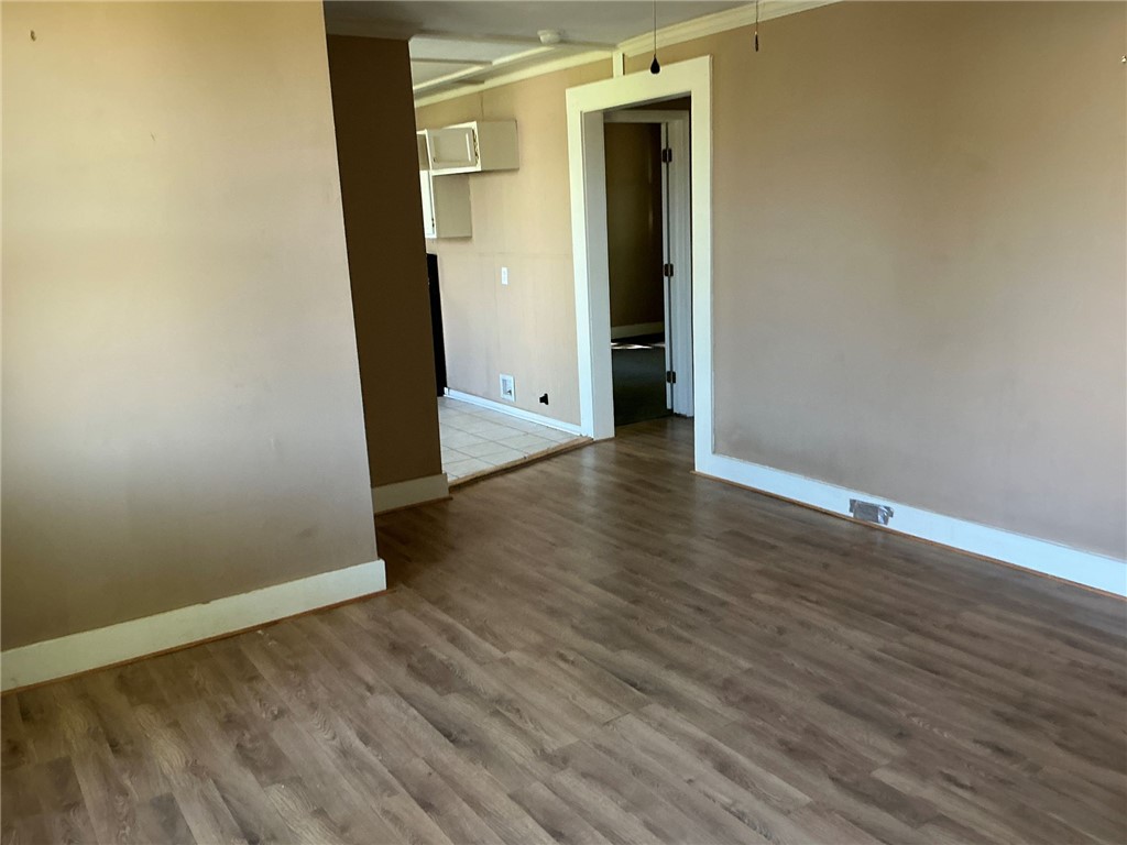 11 Humbert Street Seneca, SC 29678 - Photo 2 of 14 This interior offers classic wood flooring, creating a comfortable and inviting atmosphere.