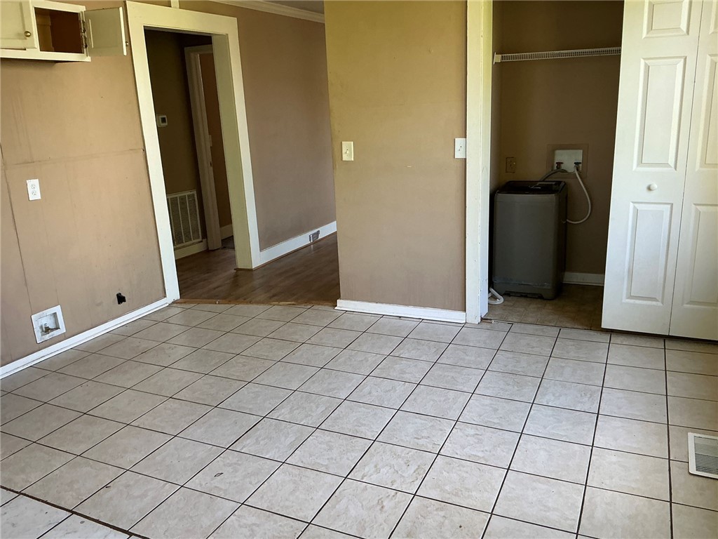 11 Humbert Street Seneca, SC 29678 - Photo 4 of 14 This functional space features tile flooring and convenient laundry amenities.