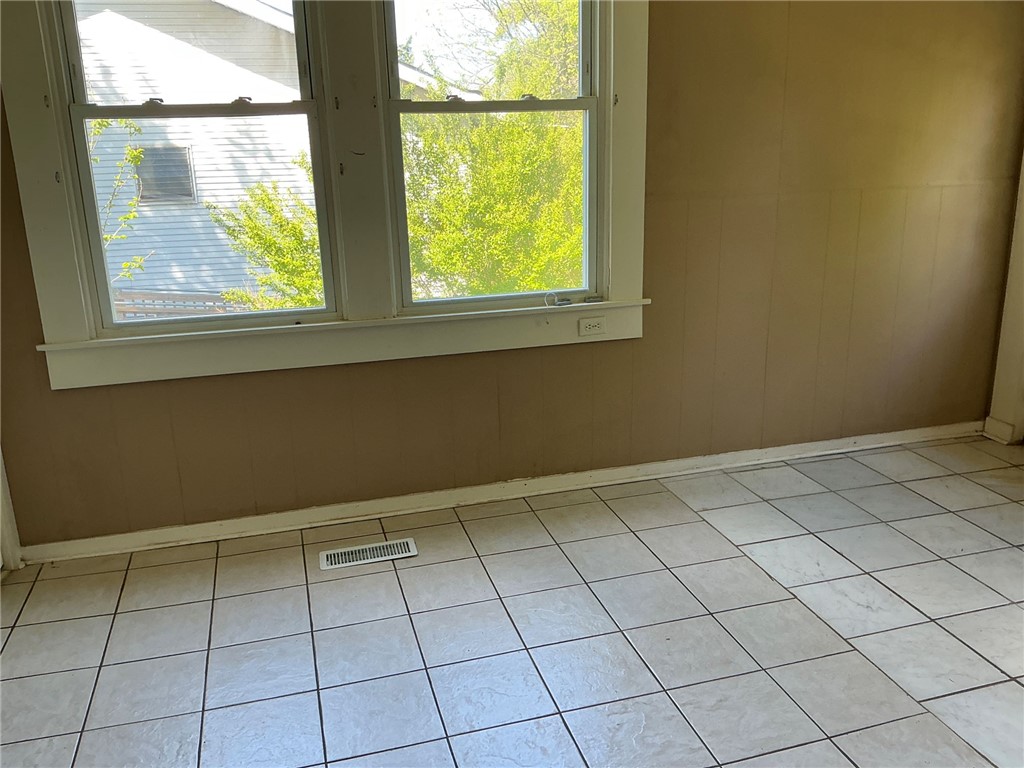 11 Humbert Street Seneca, SC 29678 - Photo 5 of 14 This bright space features ample natural light and durable tile flooring.