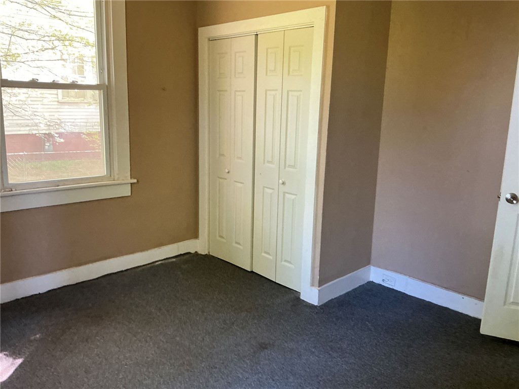 11 Humbert Street Seneca, SC 29678 - Photo 9 of 14 This cozy bedroom features ample natural light and convenient closet space.