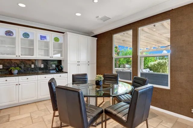 a view of a dining room with furniture window and outside view