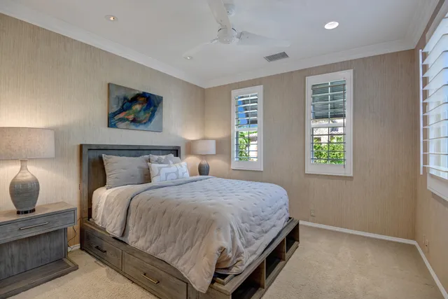 a bedroom with bed and window