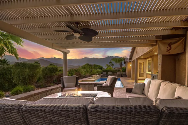 a view of a patio with couches chairs and a table