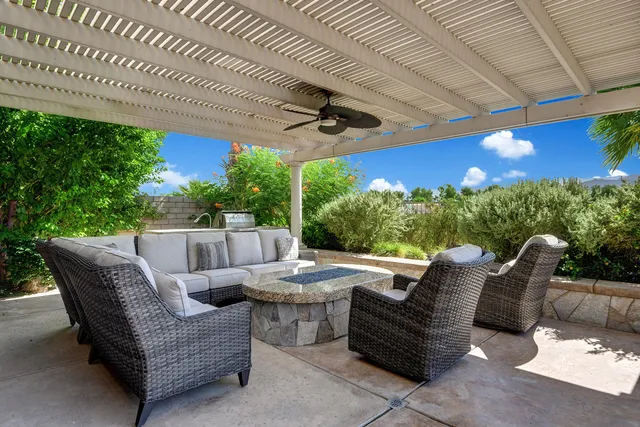 a view of a patio with a table and chairs