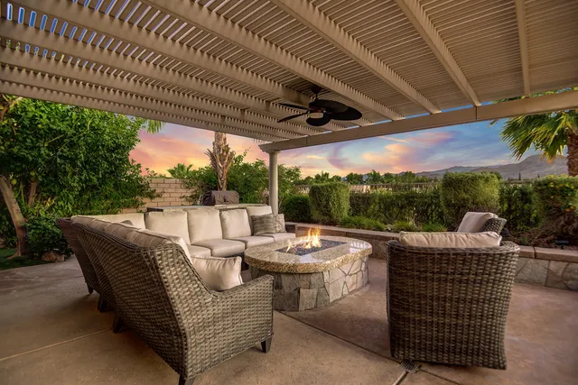 a view of outdoor space with patio furniture and garden
