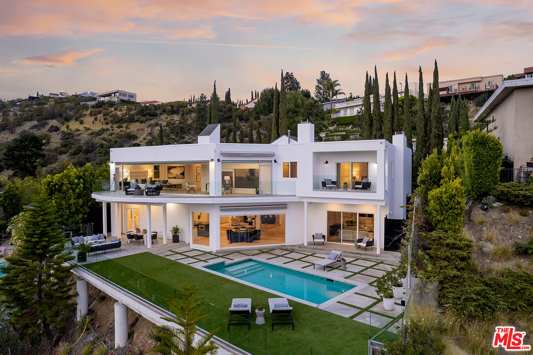 7868 Electra Drive Los Angeles, CA 90046 - Photo 1 of 38 a front view of a residential apartment building with a yard