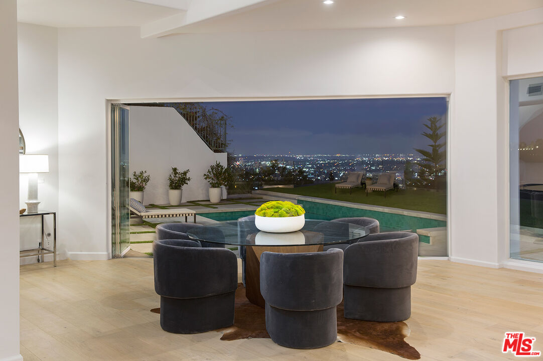 7868 Electra Drive Los Angeles, CA 90046 - Photo 14 of 38 a view of a couches and dinning table in a patio