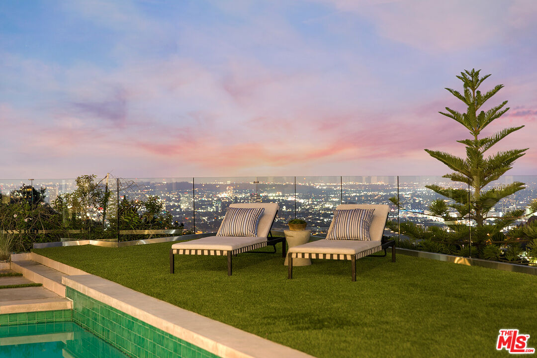 7868 Electra Drive Los Angeles, CA 90046 - Photo 17 of 38 a view of a lake with a garden