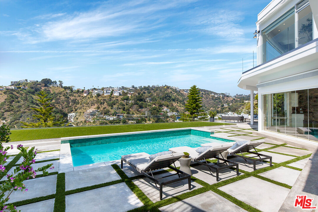 7868 Electra Drive Los Angeles, CA 90046 - Photo 19 of 38 a view of swimming pool with outdoor seating and plants