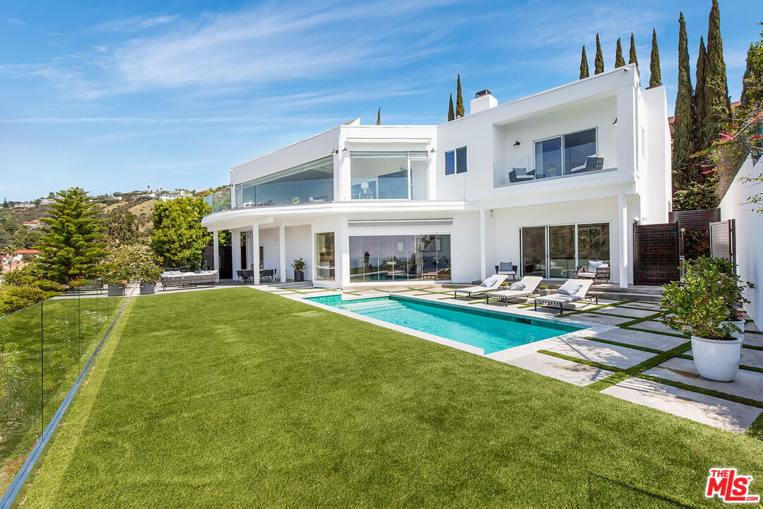 7868 Electra Drive Los Angeles, CA 90046 - Photo 2 of 38 a view of house with outdoor space and swimming pool