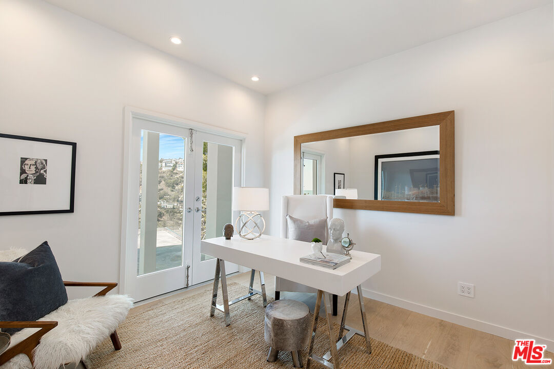 7868 Electra Drive Los Angeles, CA 90046 - Photo 23 of 38 a view of a livingroom with furniture and wooden floor