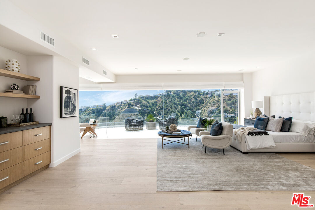 7868 Electra Drive Los Angeles, CA 90046 - Photo 26 of 38 a living room with furniture and a large window