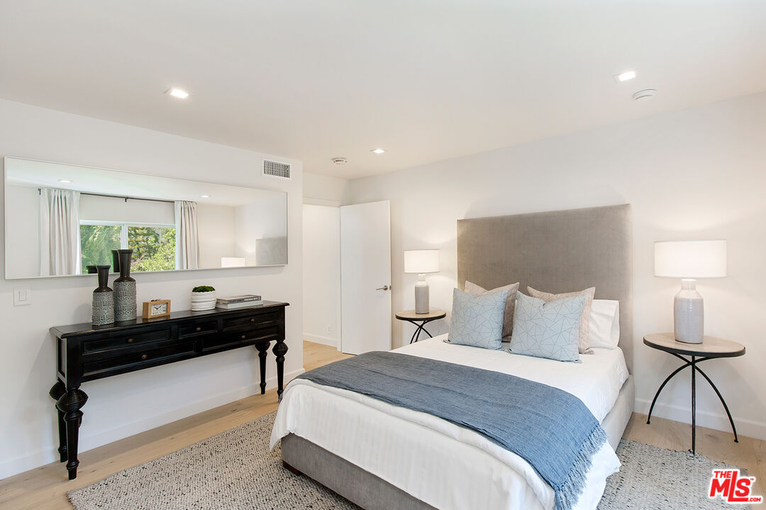 7868 Electra Drive Los Angeles, CA 90046 - Photo 35 of 38 a bedroom with a bed and a couch