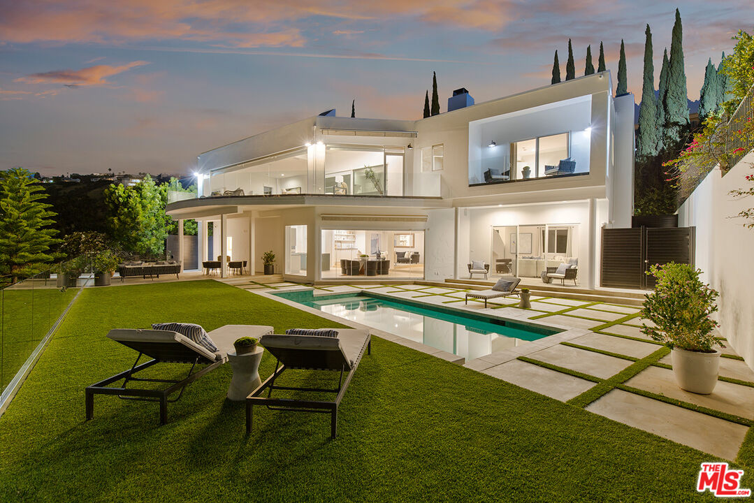 7868 Electra Drive Los Angeles, CA 90046 - Photo 37 of 38 a house view with swimming pool and outdoor seating