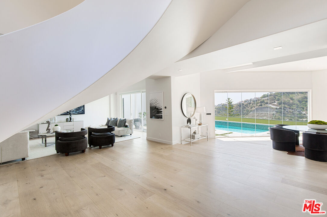 7868 Electra Drive Los Angeles, CA 90046 - Photo 7 of 38 a view of a living room and a floor to ceiling window