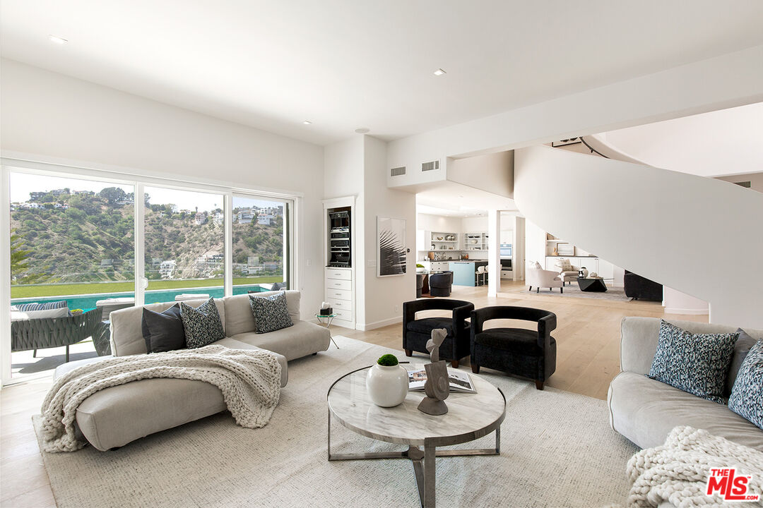 7868 Electra Drive Los Angeles, CA 90046 - Photo 8 of 38 a living room with furniture and a large window