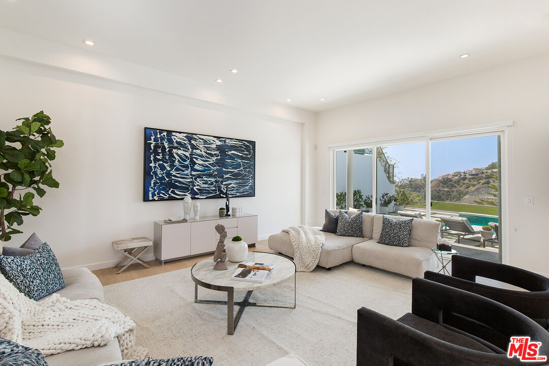 7868 Electra Drive Los Angeles, CA 90046 - Photo 9 of 38 a living room with furniture and a large window