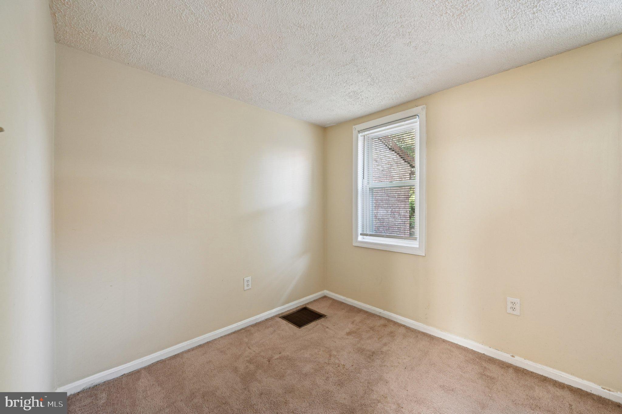 110 South Poppleton Street Baltimore, MD 21201 - Photo 19 of 39 an empty room with a window