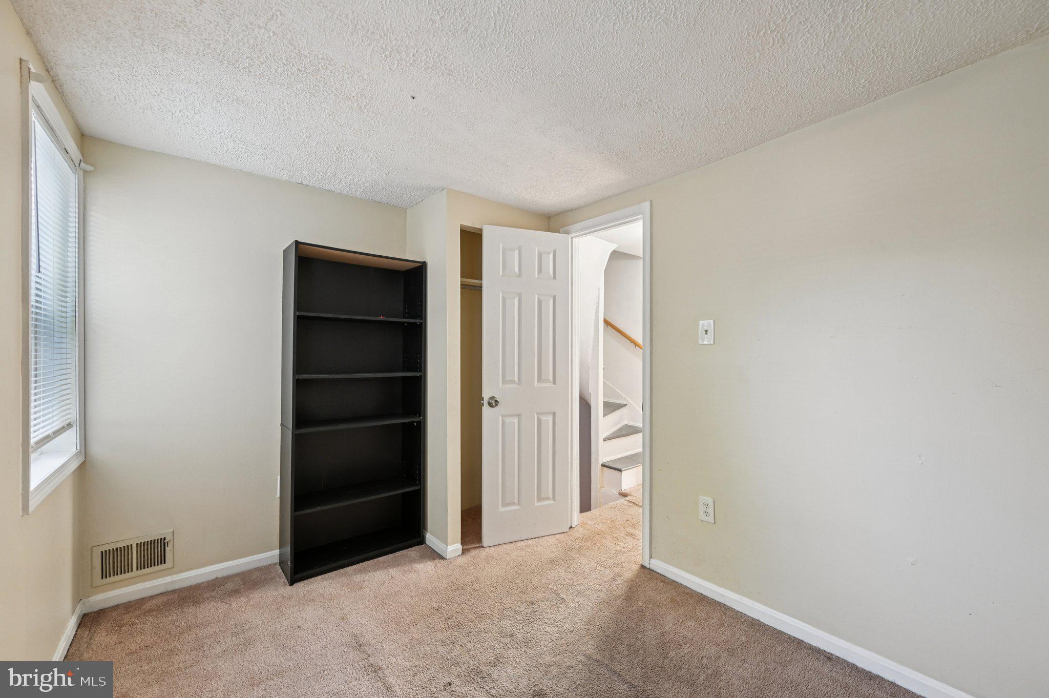 110 South Poppleton Street Baltimore, MD 21201 - Photo 21 of 39 a view of an empty room with closet and entryway