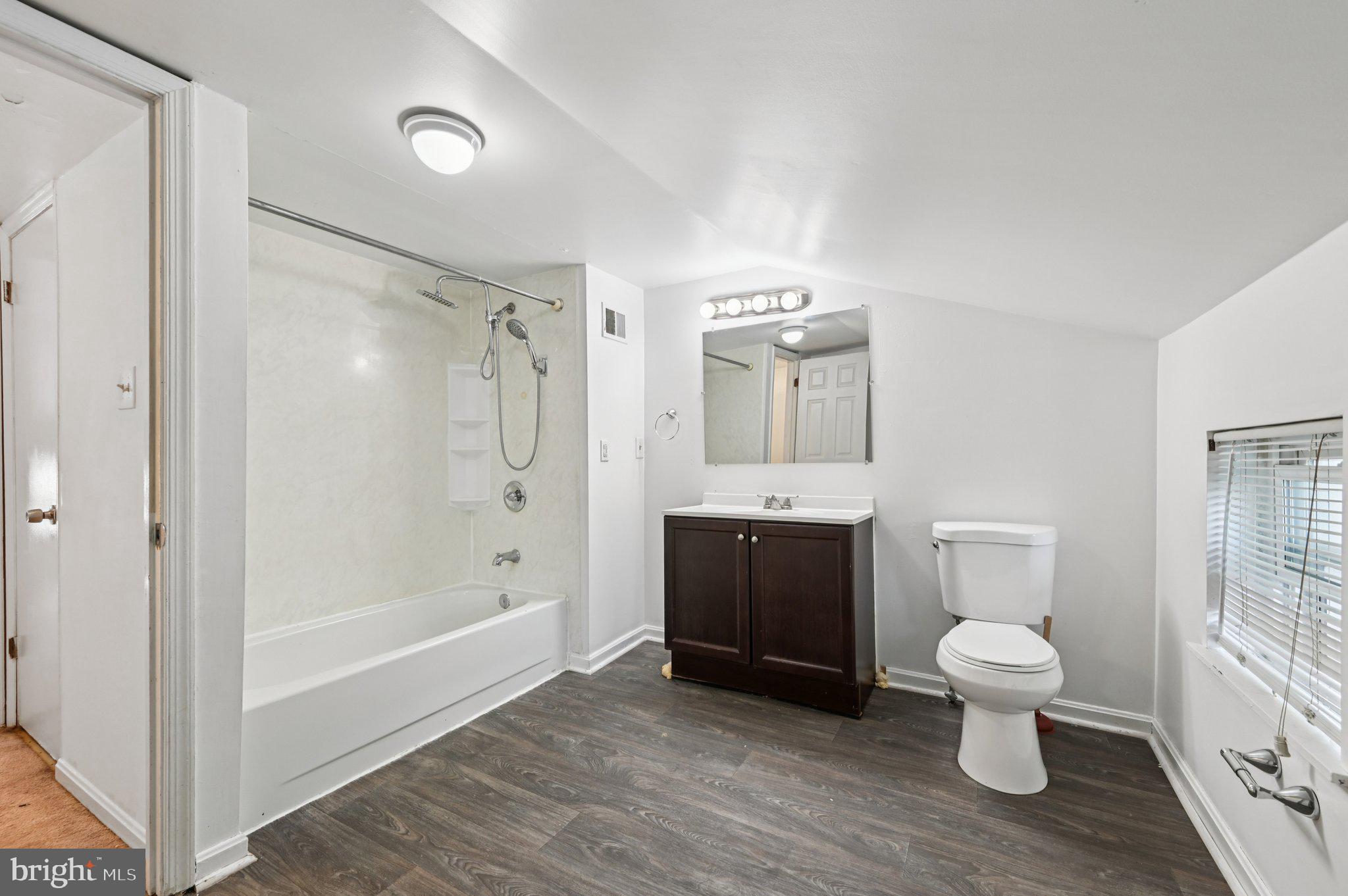 110 South Poppleton Street Baltimore, MD 21201 - Photo 26 of 39 a bathroom with a toilet sink and shower