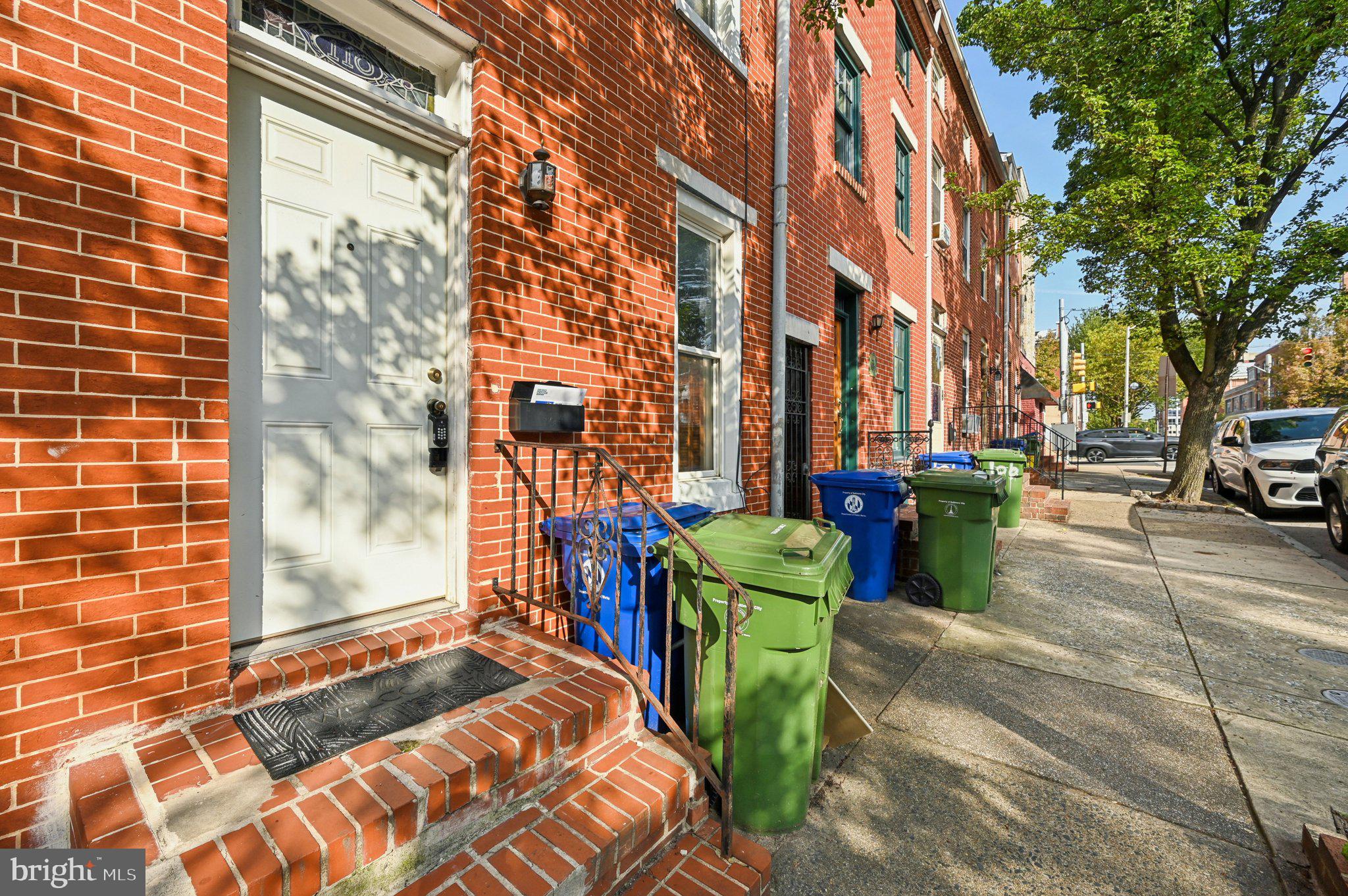 110 South Poppleton Street Baltimore, MD 21201 - Photo 3 of 39 a view of a building with sitting area