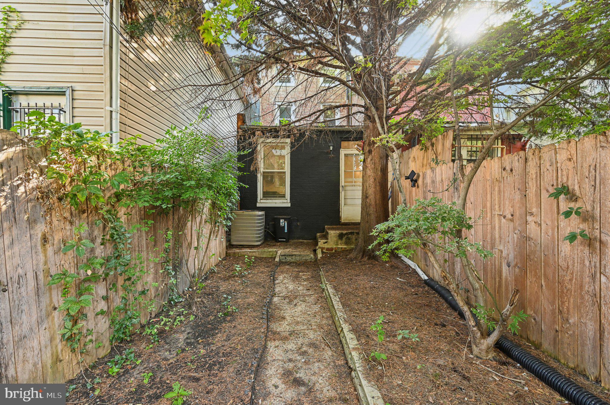 110 South Poppleton Street Baltimore, MD 21201 - Photo 32 of 39 a view of a house with a yard