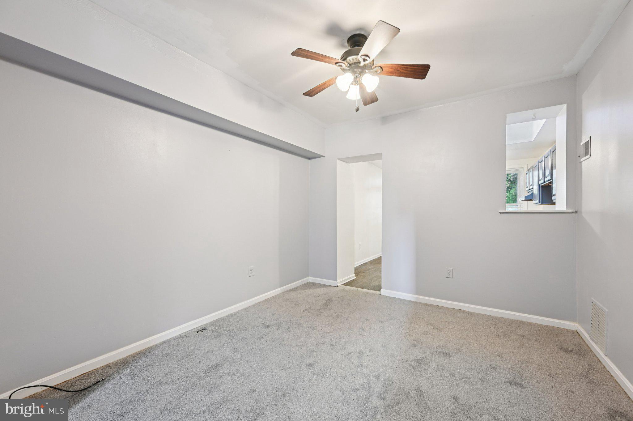 110 South Poppleton Street Baltimore, MD 21201 - Photo 9 of 39 en view of an empty room with a chandelier fan