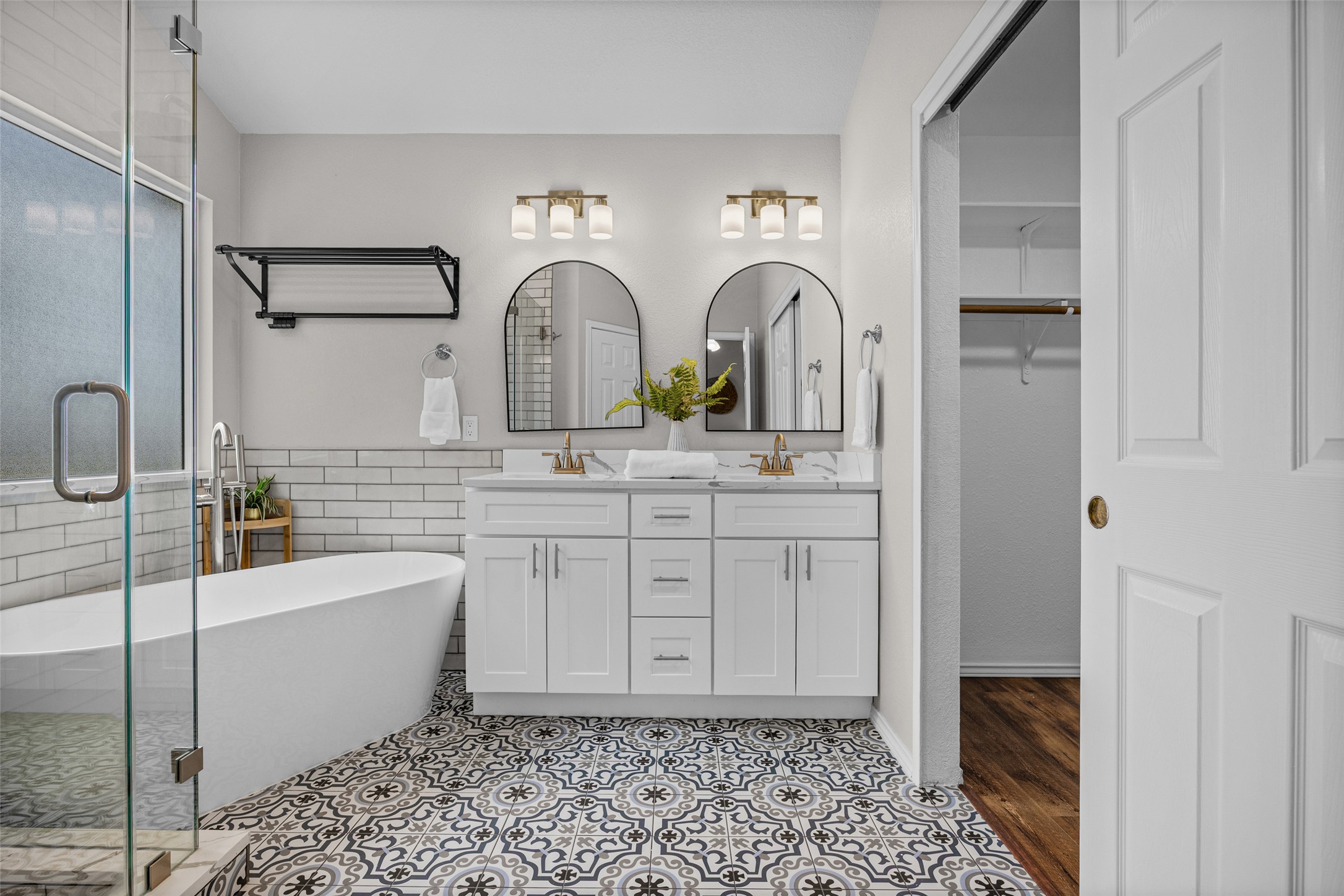 1524 Lochaline Loop Pflugerville, TX 78660 - Photo 3 of 22 Elegant freestanding soaking tub and dual vanity define this well-appointed primary bathroom.