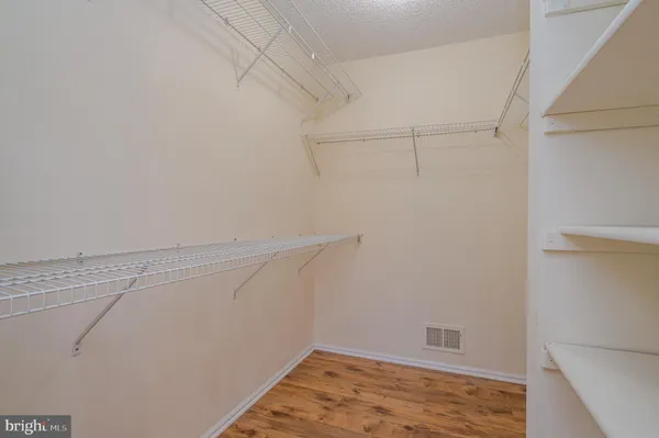 a view of a room with racks on the wall