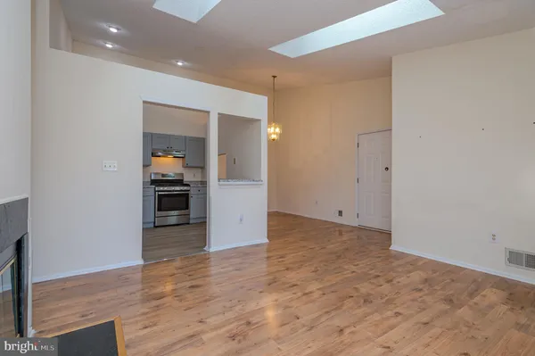 a view of kitchen and wooden floor