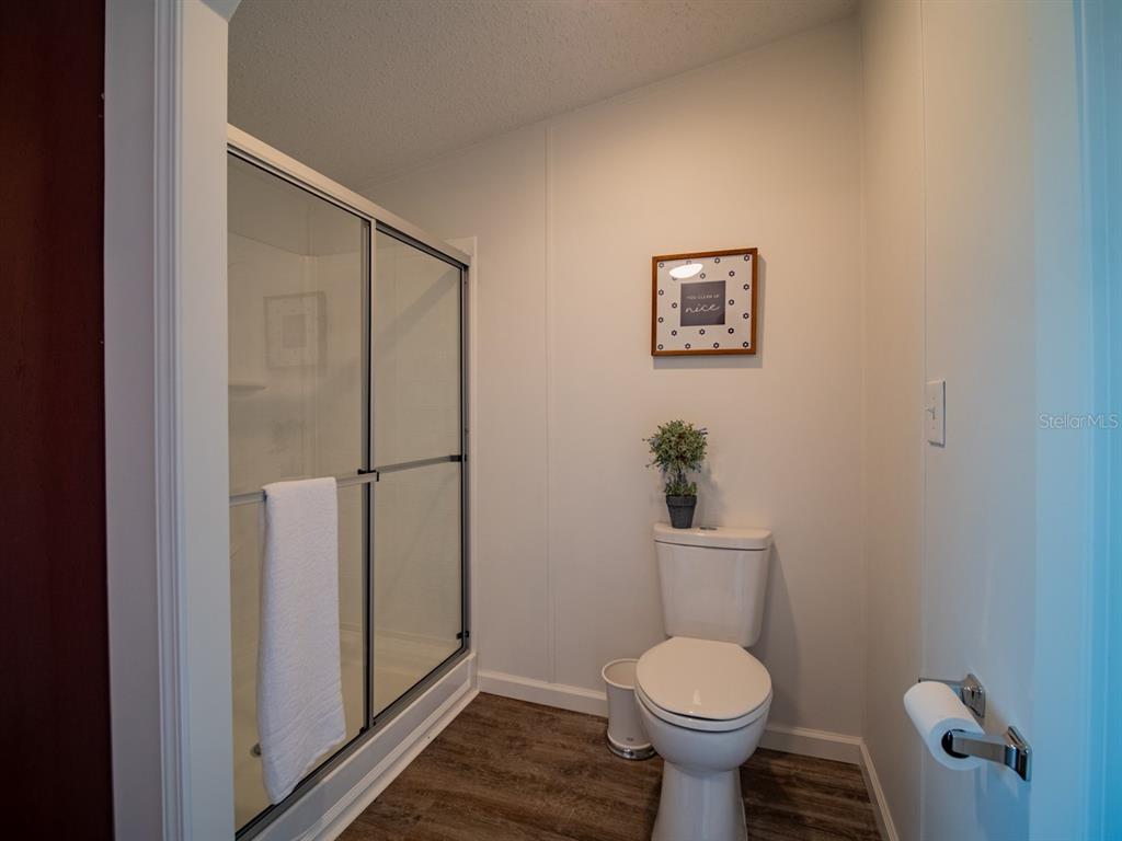 19456 161st Court O'Brien, FL 32071 - Photo 28 of 60 a bathroom with a toilet and a shower