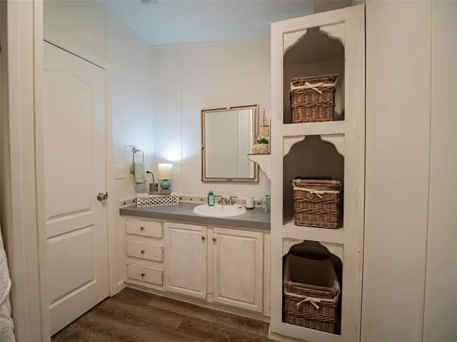 a bedroom with furniture and a window